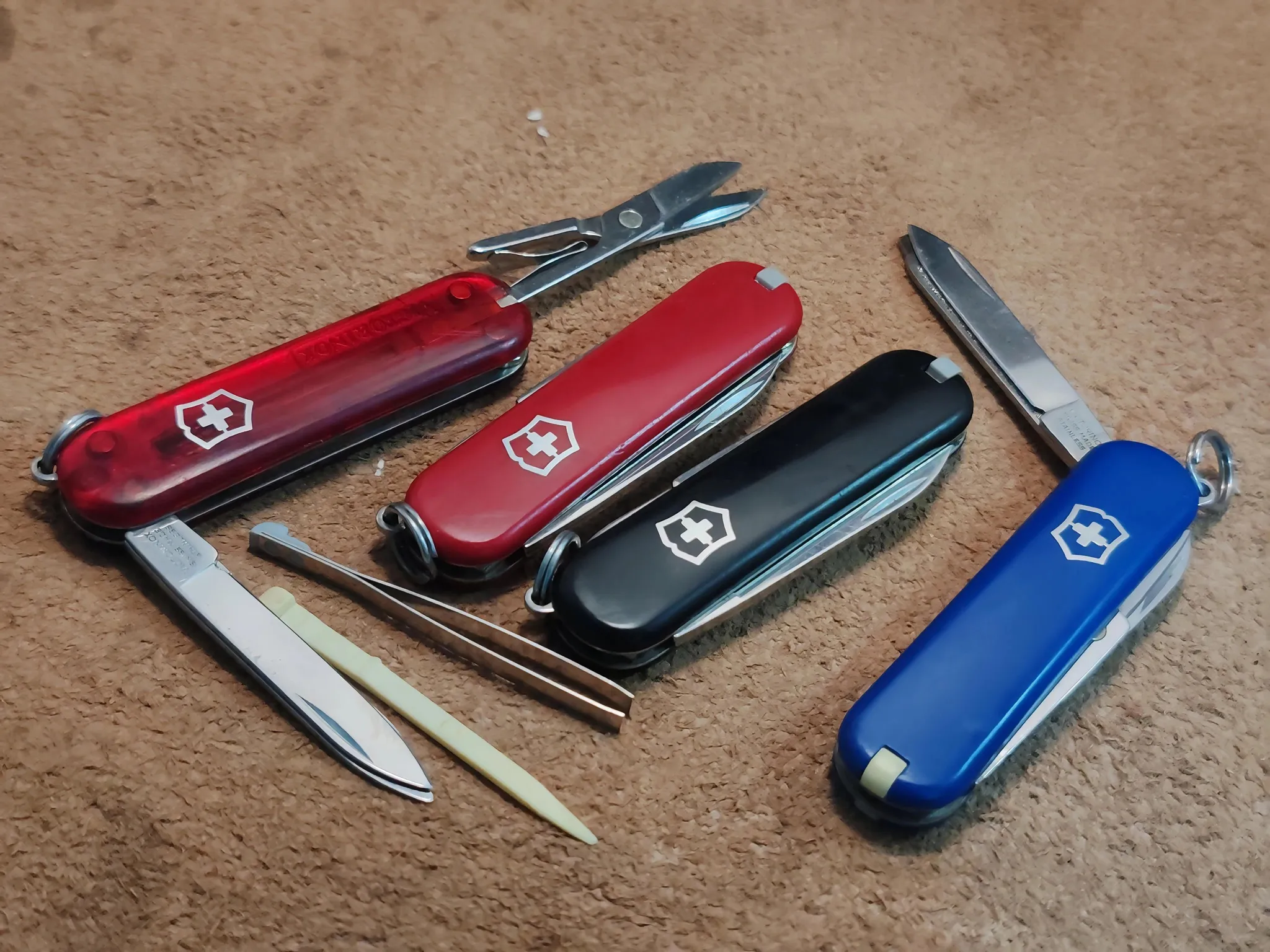 Buy used Victorinox Preloved EDC Multi-tool Set - Red, Black, Blue, Translucent Red - 4-piece Bundle online on Resellpur