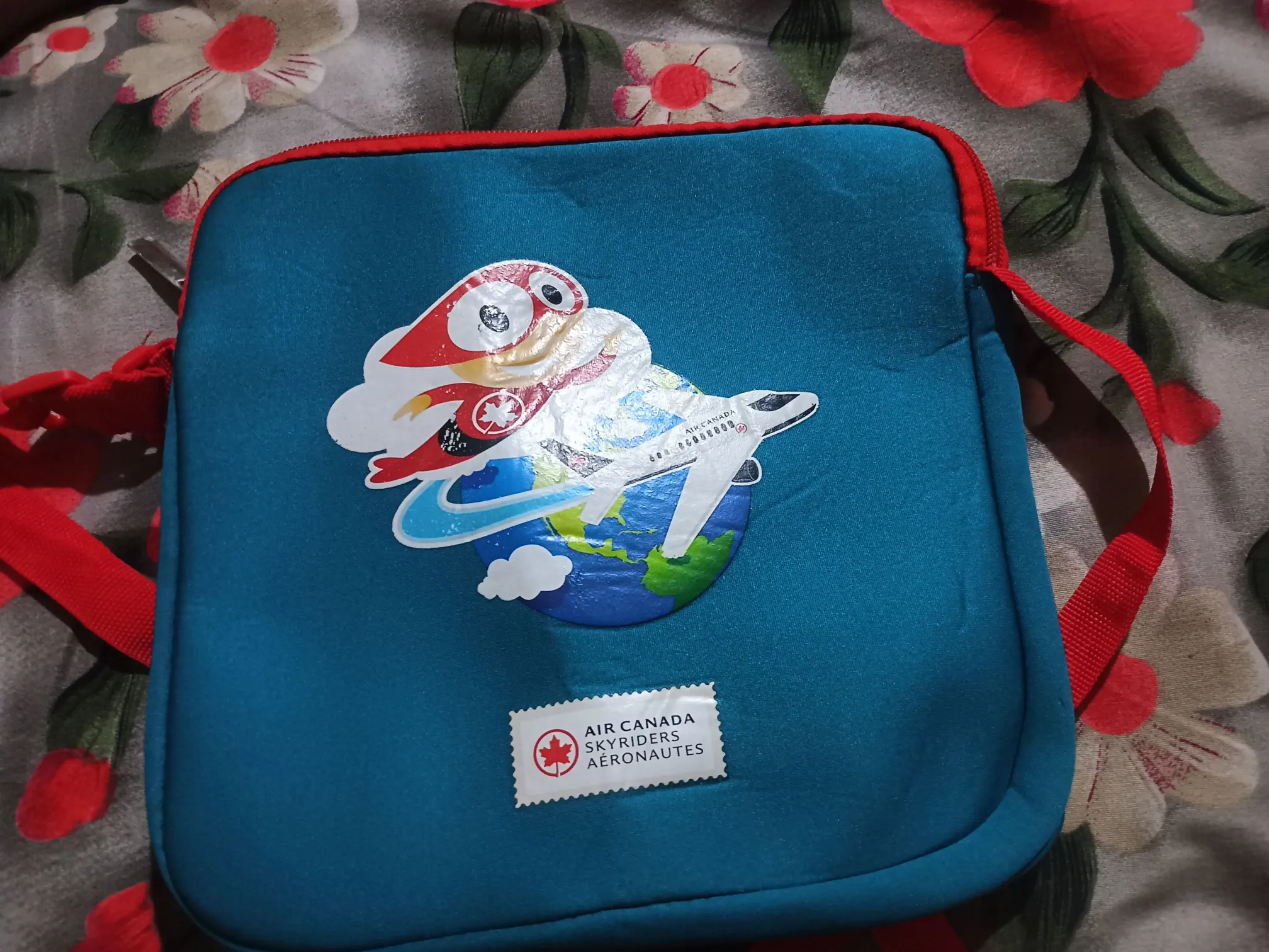 Buy used Air Canada Skyriders Kids Travel Sling Bag Blue With Red Straps Adjustable online on Resellpur