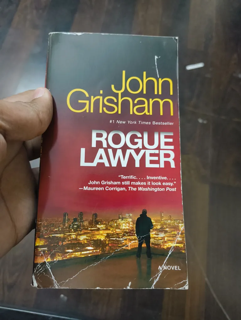 John Grisham Rogue Lawyer - English Paperback Novel, Slight Corner Tear