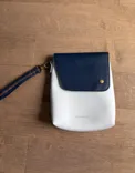 Buy used Raven + Lily Very Good Condition Women's Wristlet Pouch Grey Navy Detachable Strap online on Resellpur